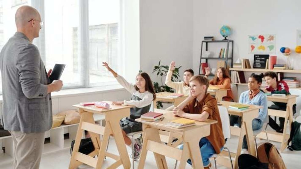 students and teacher in a classroom