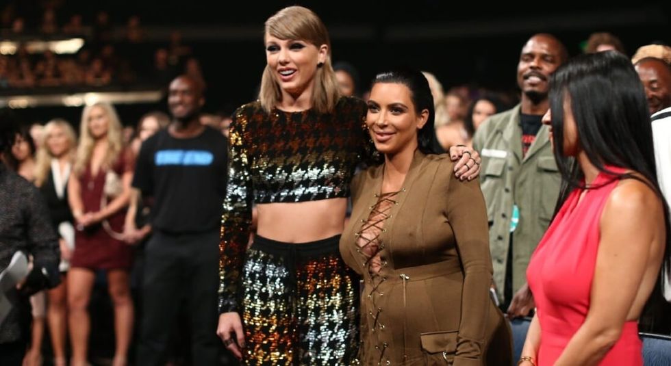 Taylor Swift hugging Kim Kardashian.