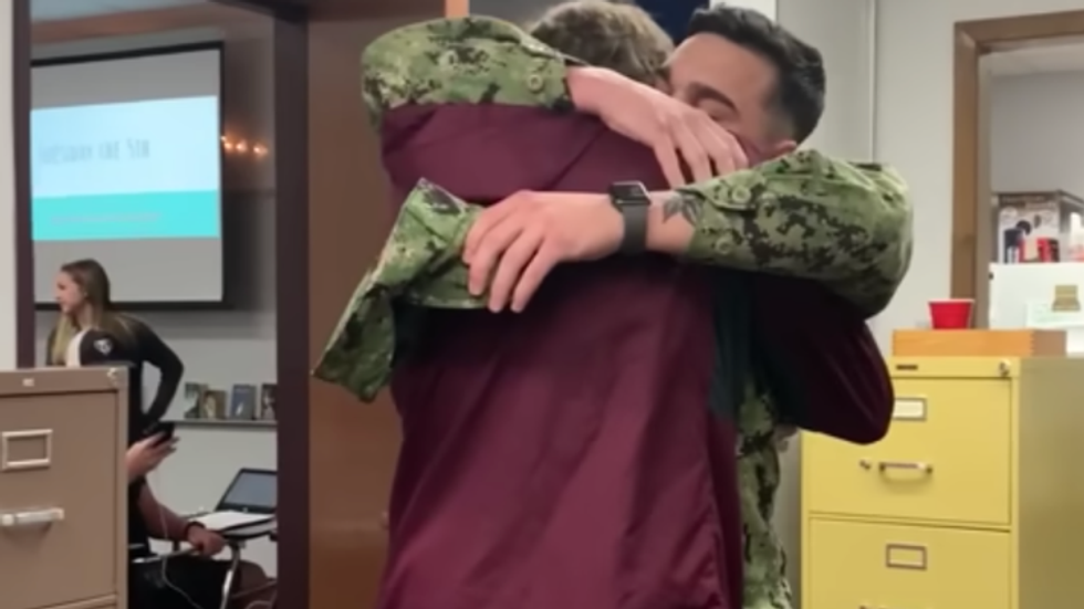 teen hugging his brother