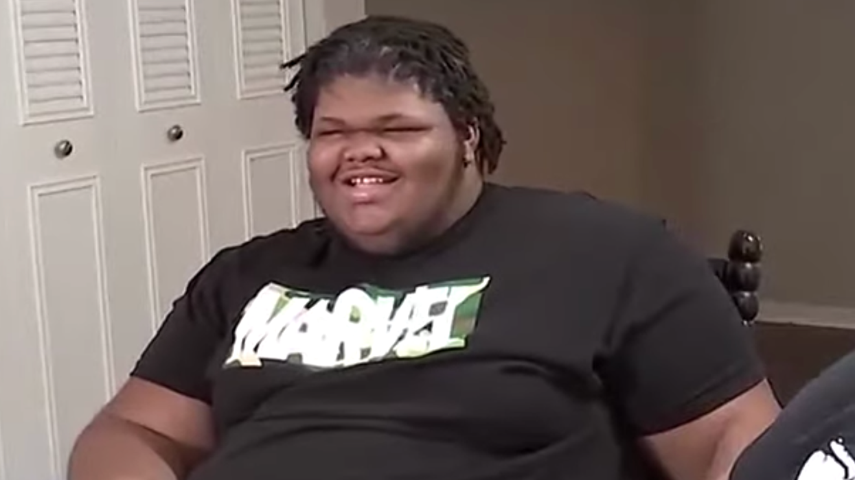 Teen in a Marvel shirt gives an interview