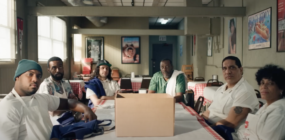 The cast of The Bear at a table