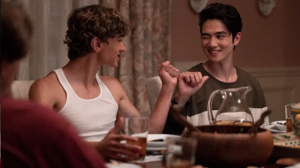 the summer I turned pretty conrad dinner table fist bump