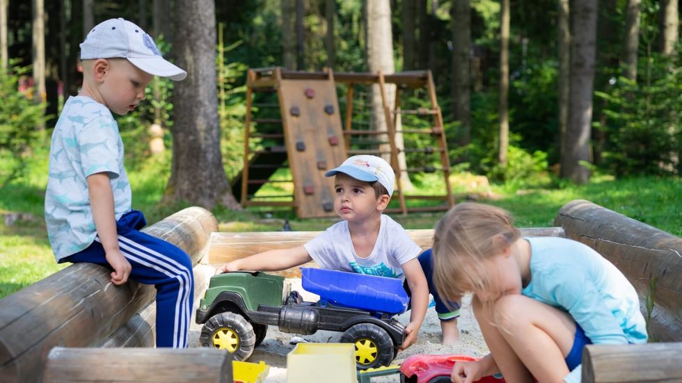 three children playing in the park