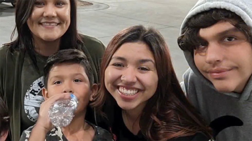 three people and a little boy