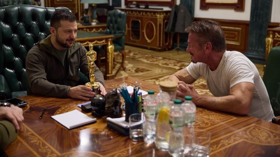 two men sitting at a table