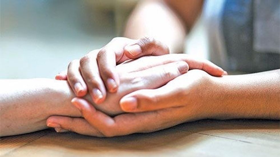 two people holding hands