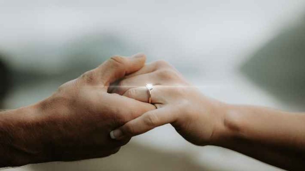 two people holding hands