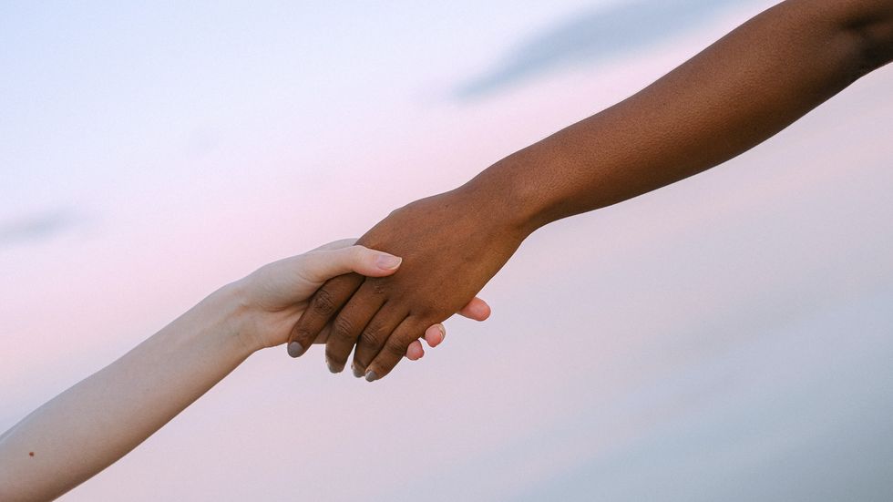 two people holding hands