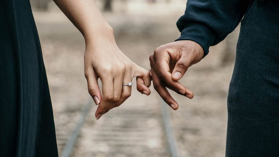 two people holding hands