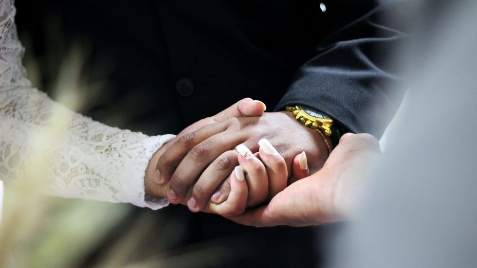 two people holding hands