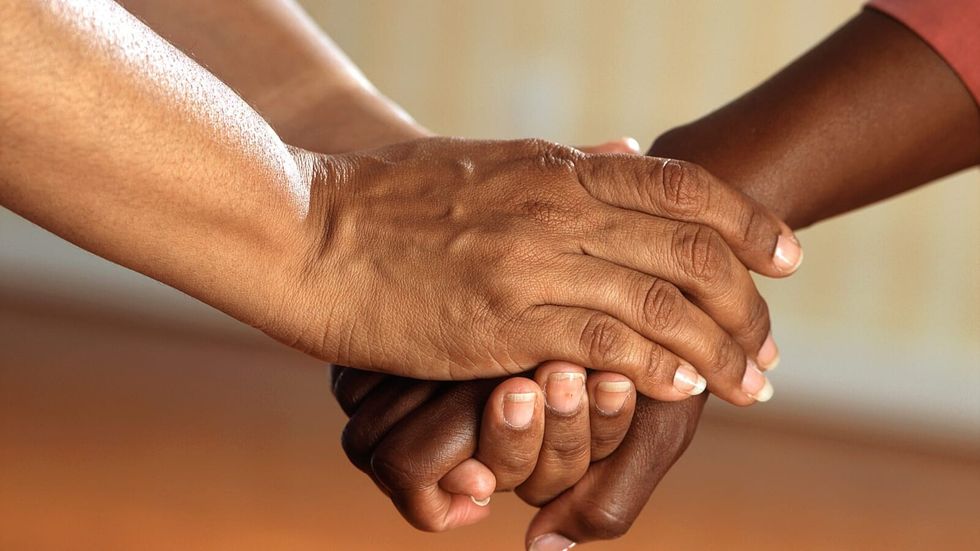 two people holding hands
