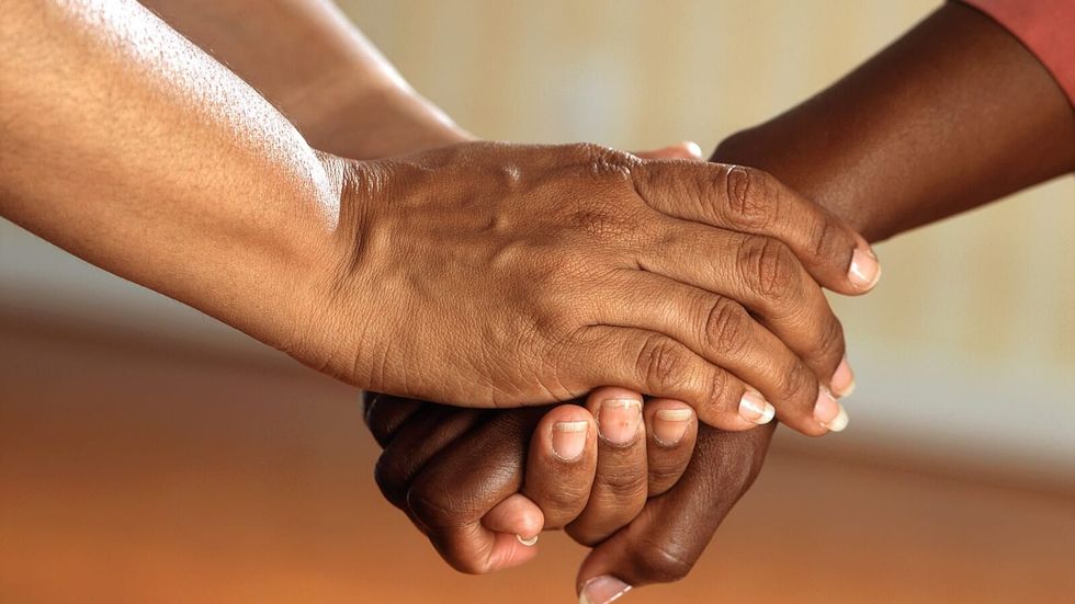 two people holding hands