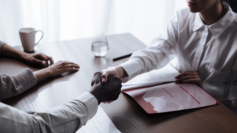 two people shaking hands