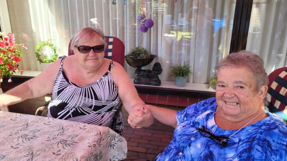 two women holding hands