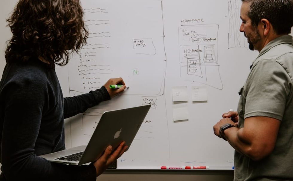 white board conversation between two adults