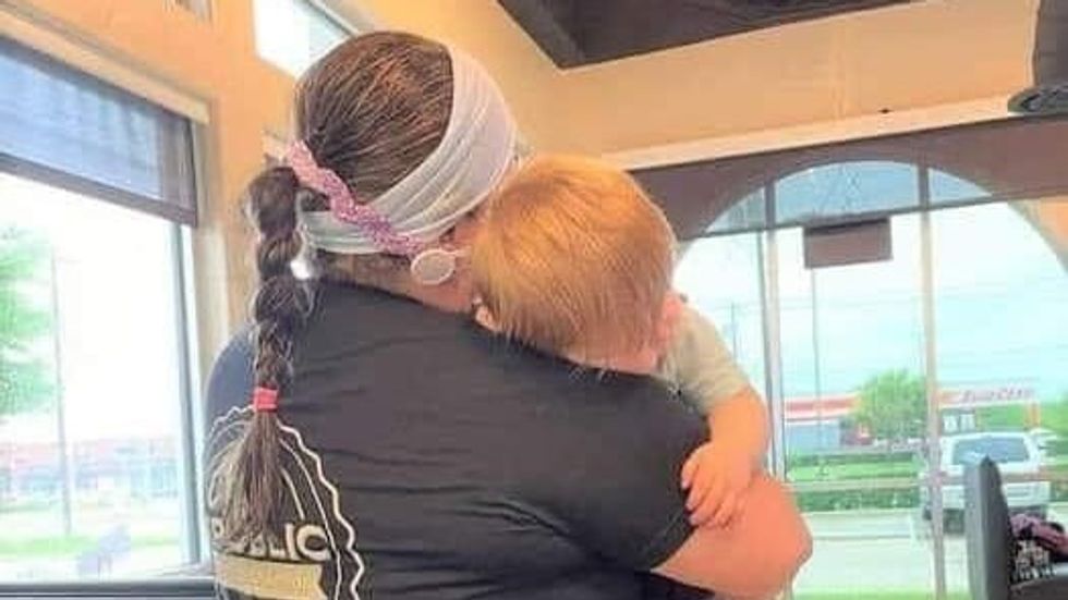 woman carrying a baby