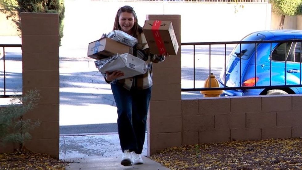 woman carrying lots of gifts