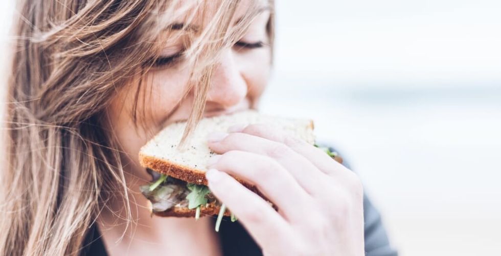woman eating sandwich
