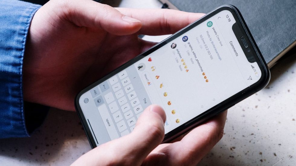 woman holding a phone in her hands