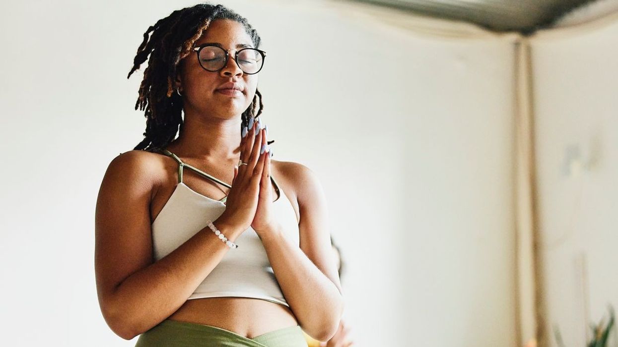 woman holding hands together in harmony