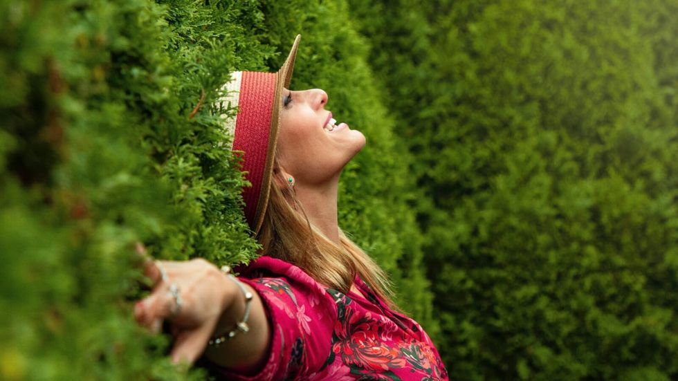 woman in floral dress lying on grass