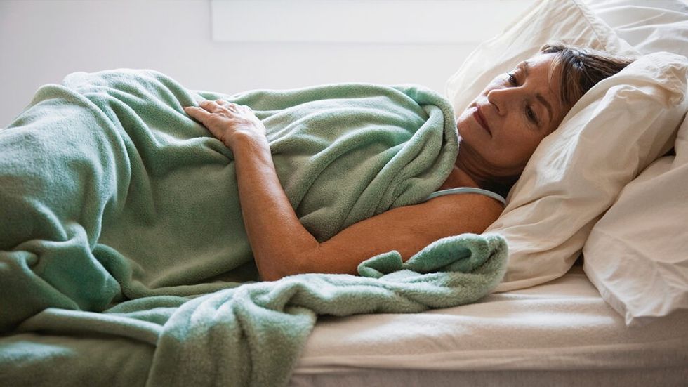 Woman lying in bed