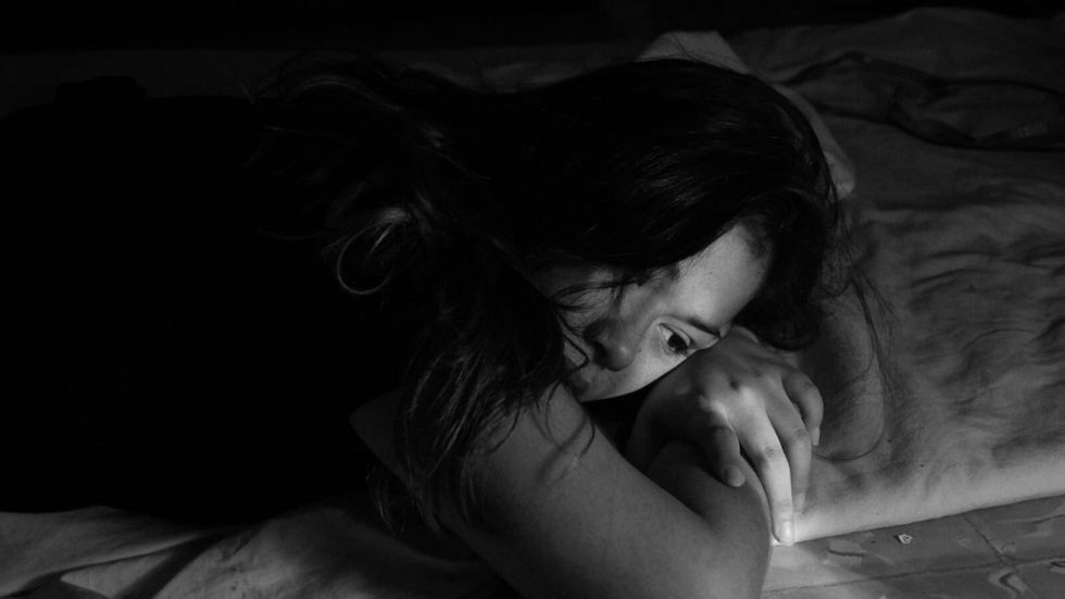 woman lying on a bed