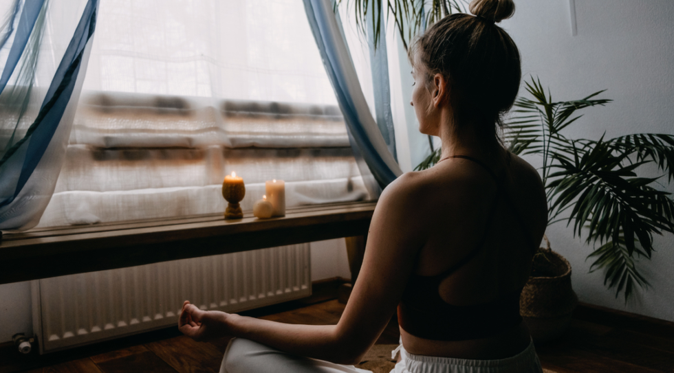 woman meditating at home