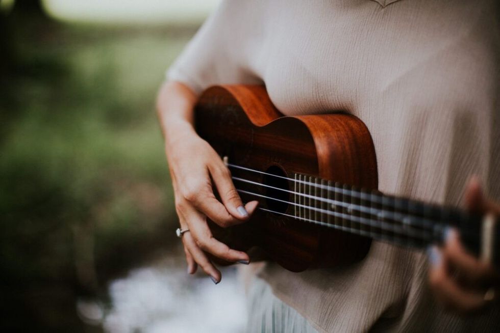 Woman-playing-ukelele