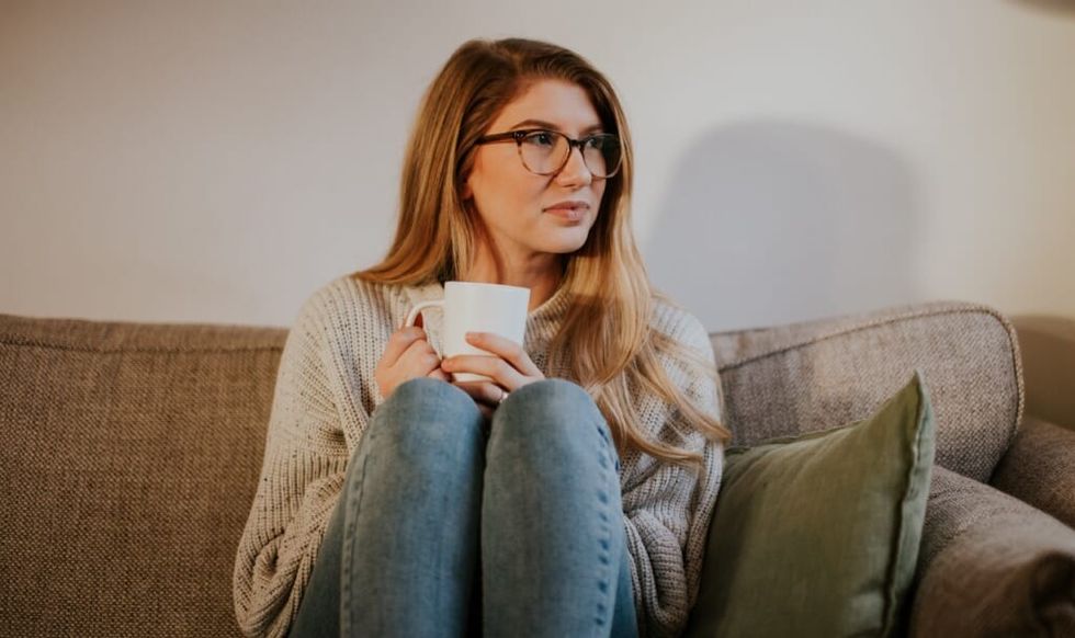 woman sitting on couch