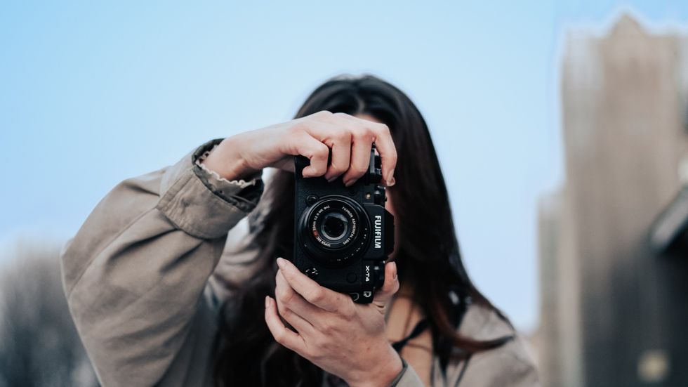 woman taking pictures with her camera