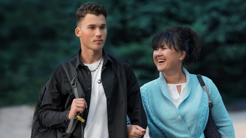 woman walking with young man