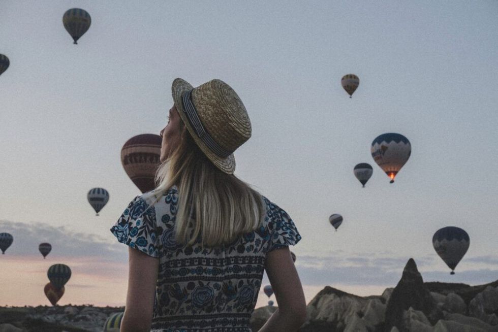 Woman-watching-hot-air-balloons