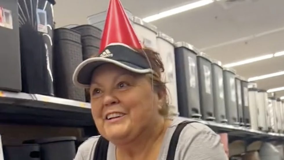 woman wearing a red party hat