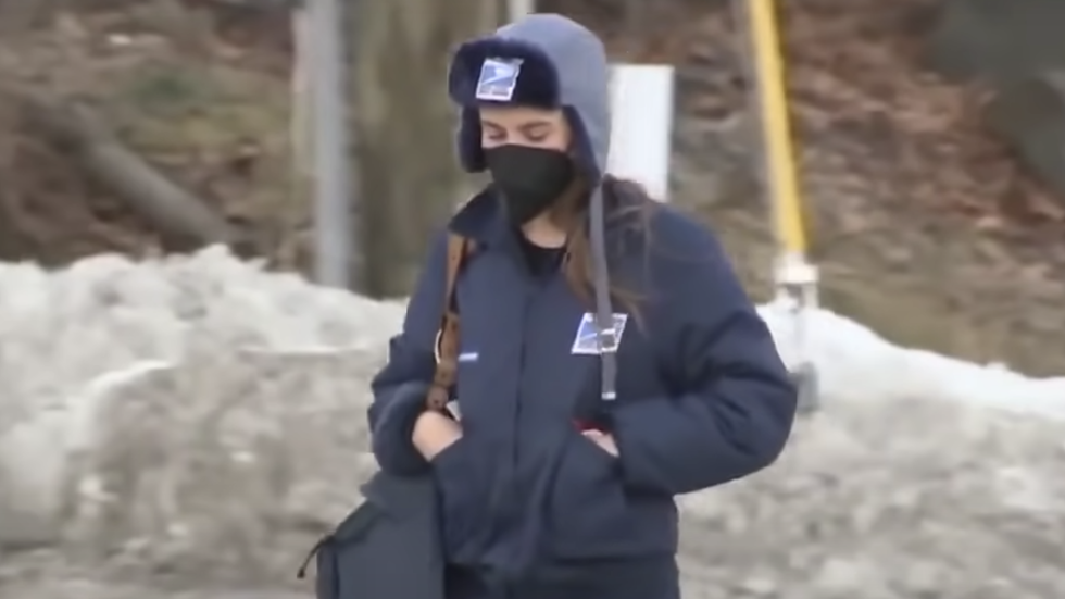 woman wearing a winter coat and a beanie