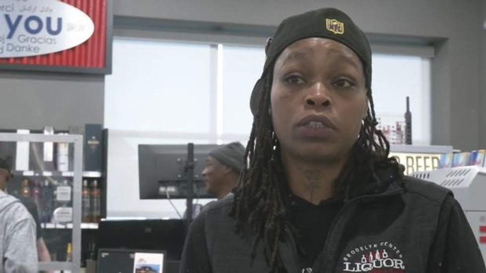 woman wearing black clothes and a black hat