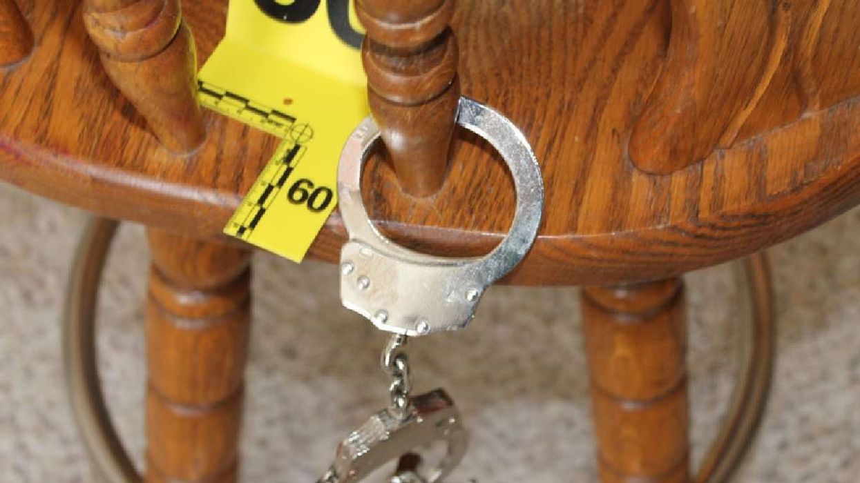 Wooden chair and handcuffs used by armed assailant in home invasion in Idaho.