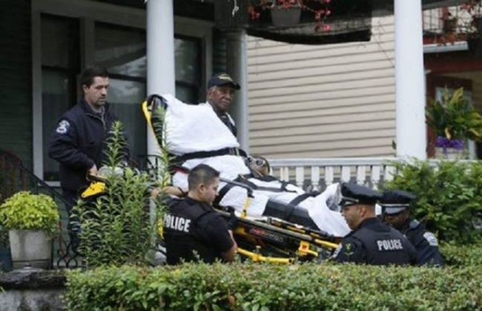 WWII veteran being evicted from his home by police on a stretcher