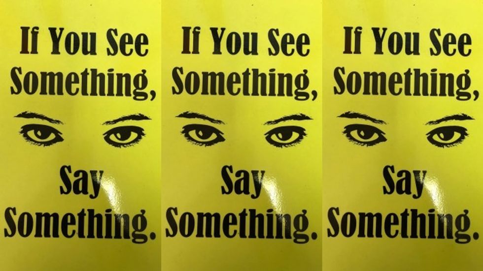 yellow posters with a pair of eyes at the center