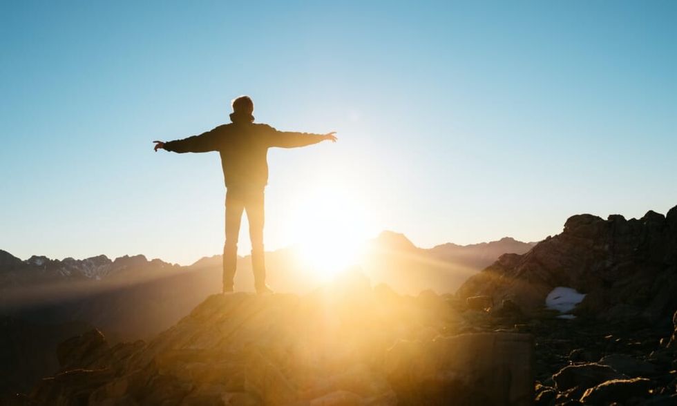 young man finds hope on a beautiful day outside