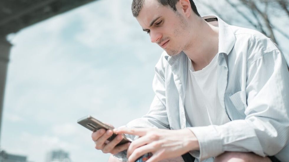 young man looks online