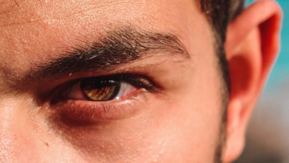 young man's eye looking intense