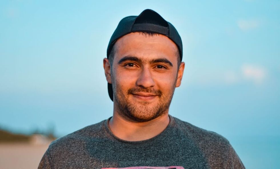 young man smiles for camera