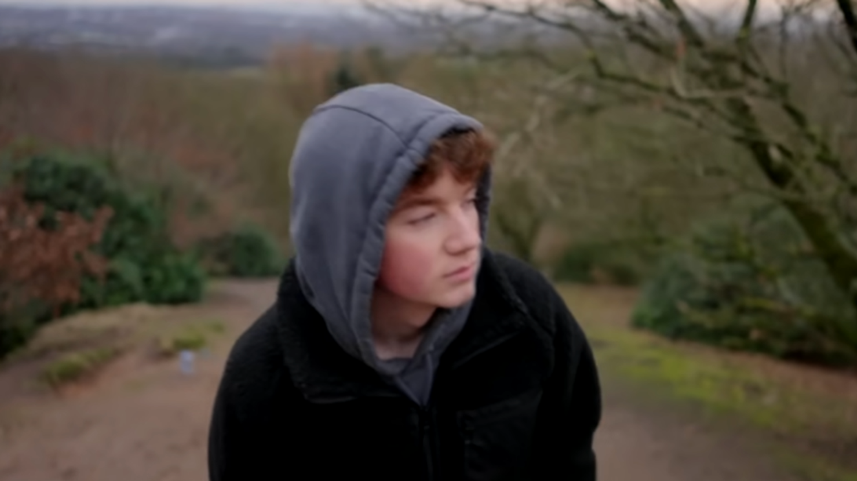 Young man wearing a hoodie.