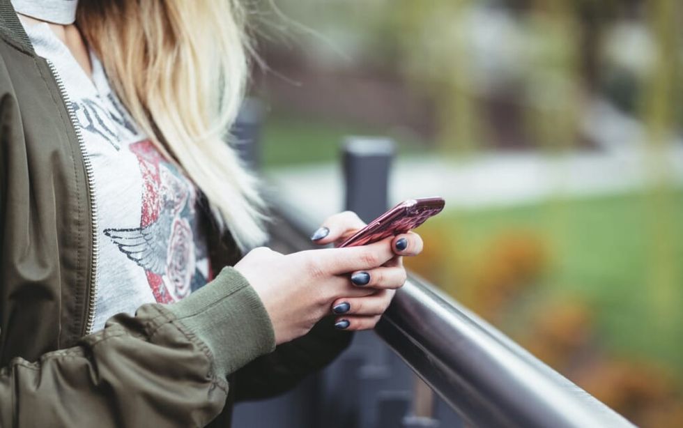 young woman receives unfortunate text message