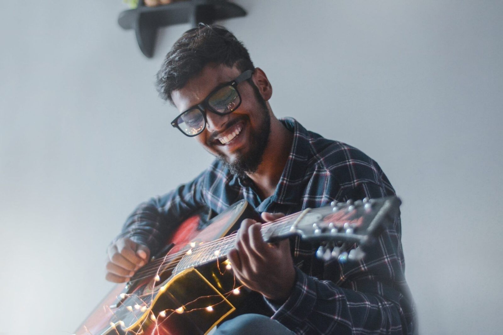 happy-man-playing-guitar