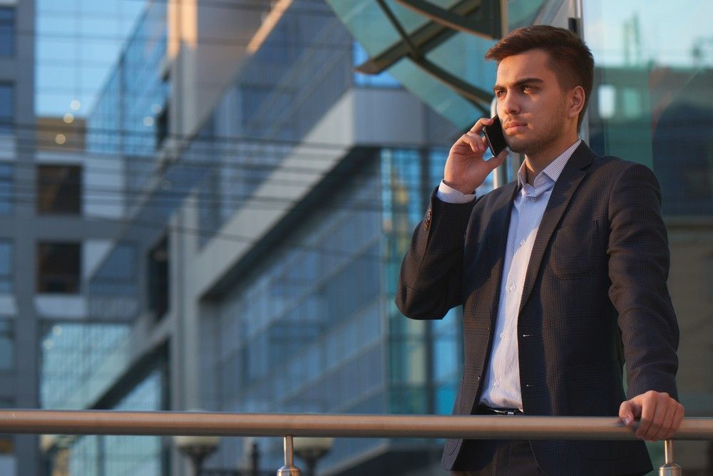 businessman-talking-phone-looking-stressed