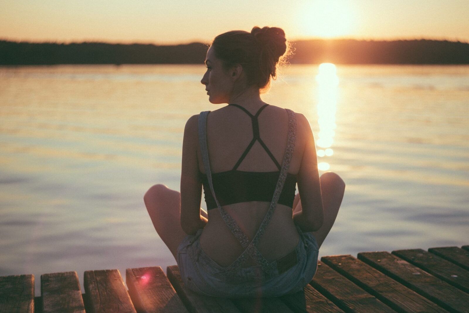 woman-meditating-on-dock