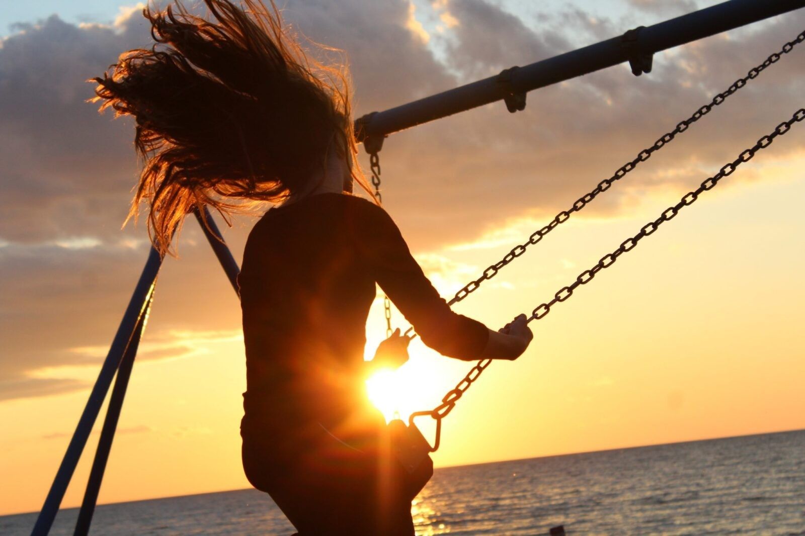 woman-swing-at-sunset