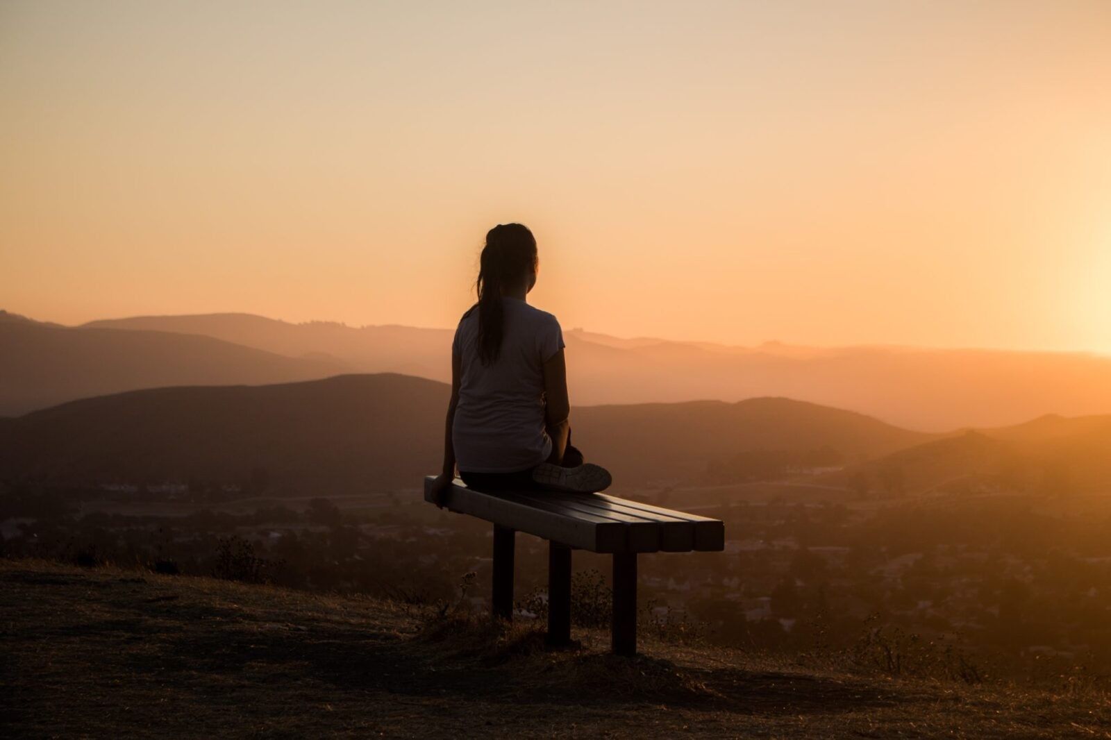 woman-sitting-alone-isolated-bench